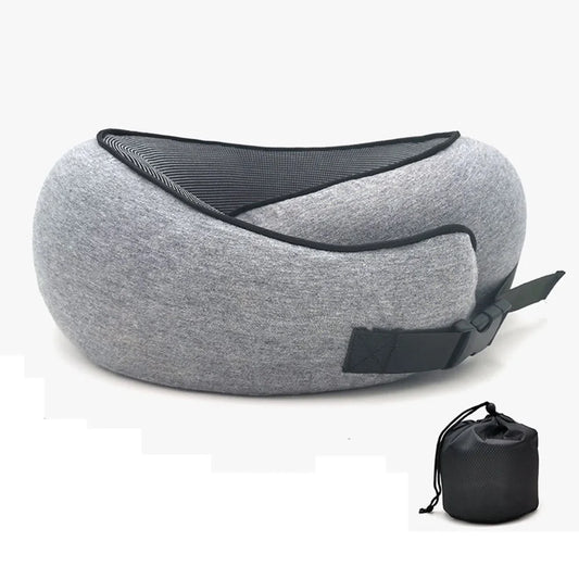 Traveler© U-Shaped Neck Pillow in grey with ergonomic design and adjustable buckle for secure fit. Includes a compact storage bag for travel convenience.