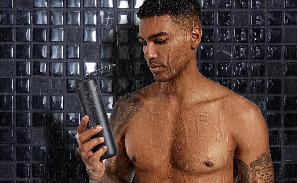 Man holding a waterproof ear wax removal device in the shower. Designed for safe and effective ear irrigation with adjustable pressure.